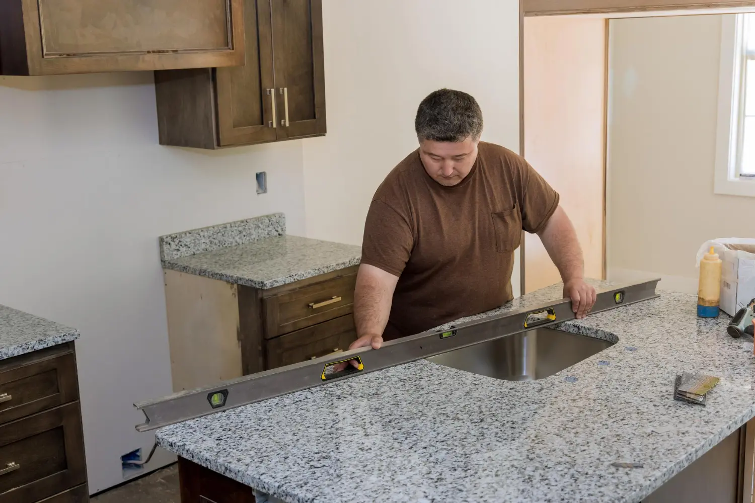 Kitchen space in Leesburg VA before renovation with worn cabinets and layout